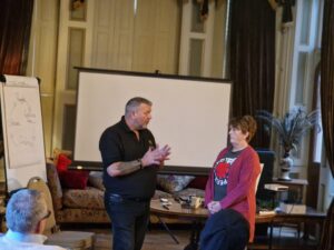 David demonstrating with a student in class